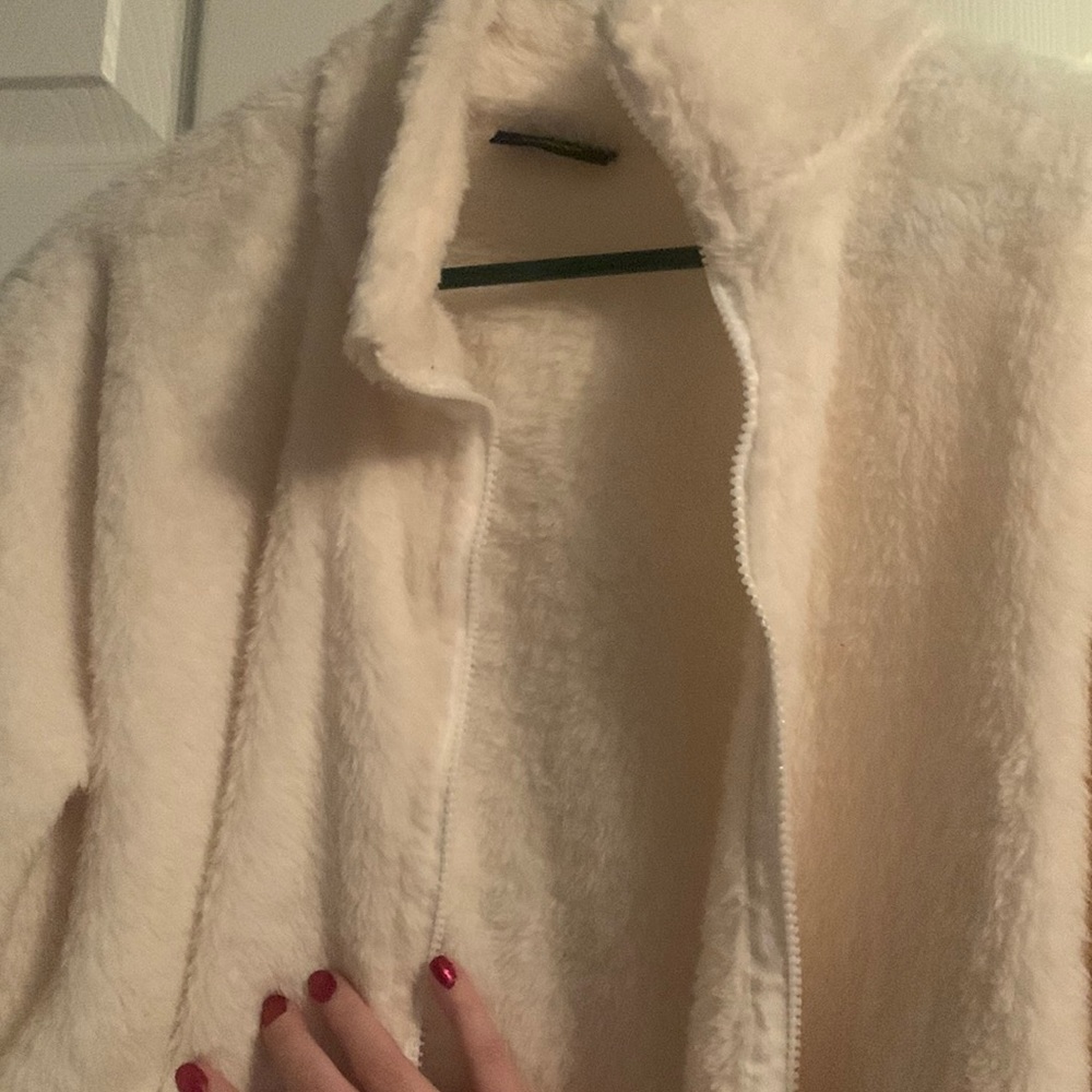Fuzzy white cream jacket. From Real Essentials size large.